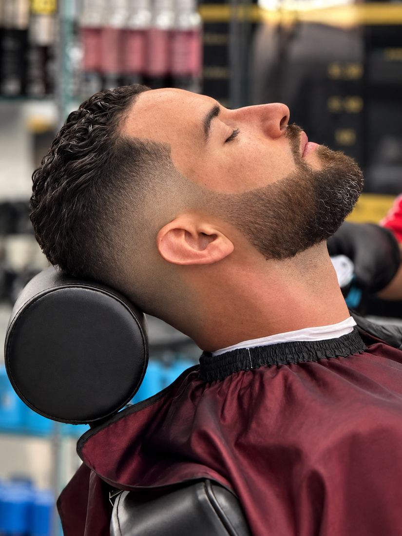 Taper fade with beard shape-up at Finesse It Pro, a barbershop near Mango