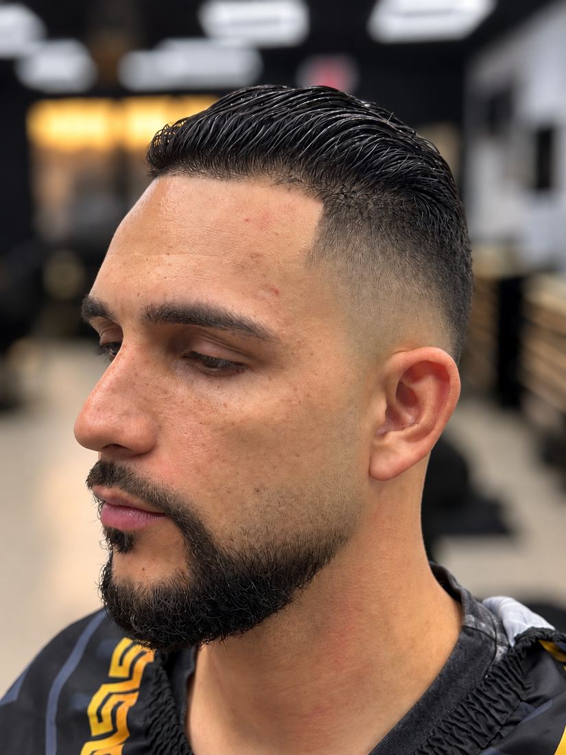 Slick back with a taper fade at Finesse It Pro, a barbershop near Riverview